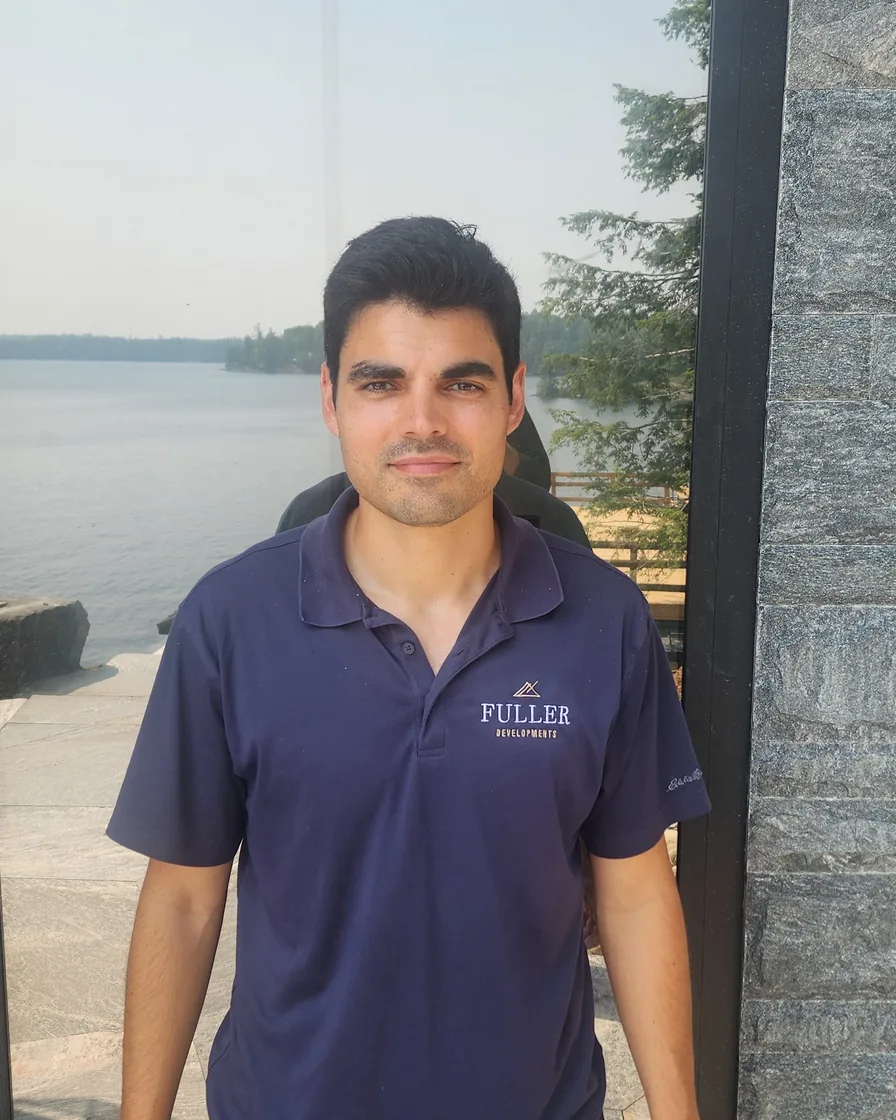 Matt Fuller in a Fuller Developments shirt at a lakefront build site in Muskoka.